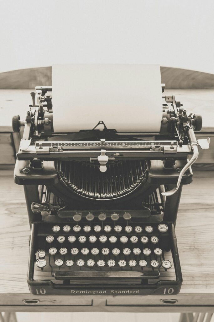 Classic Remington Standard typewriter on a wooden desk, evoking a sense of nostalgia and vintage charm.