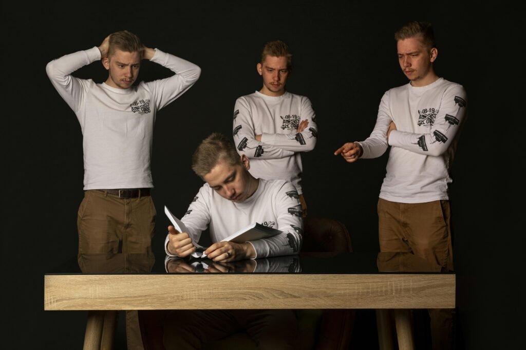 Artistic multiple exposure of a man at a desk, reading and contemplating ideas.